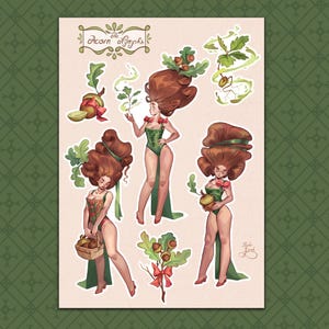 May include: A sticker sheet titled The Acorn Nymph featuring illustrations of a character with voluminous brown hair, green leotards, and oak leaf accents. The sheet includes individual stickers of acorns, leaves, and the character in various poses.