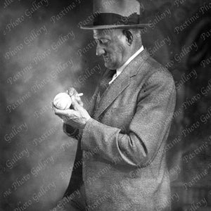 Print of Honus Wagner Signing a Baseball From The Original Negative