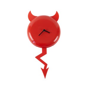 May include: A red wall clock shaped like a devil, with horns, a round face, and a lightning bolt tail. The clock has black hands and a glossy finish. The design is modern and playful.
