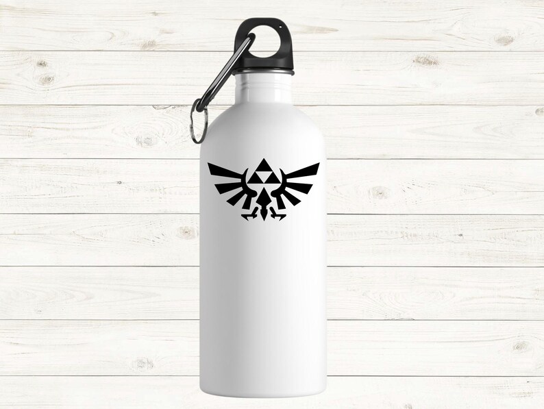 May include: White metal water bottle with a black lid and a black carabiner clip. The bottle has a black emblem graphic. The bottle is cylindrical.