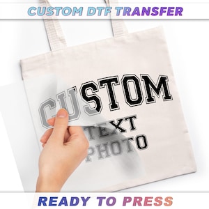 a person holding a tote bag that says custom next to a photo
