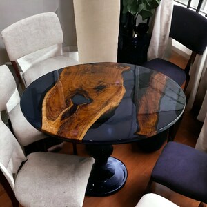 Luxury handcrafted black resin dining table
Custom round epoxy dining table
Artisan black epoxy wood furniture
Black epoxy round table for modern dining room
