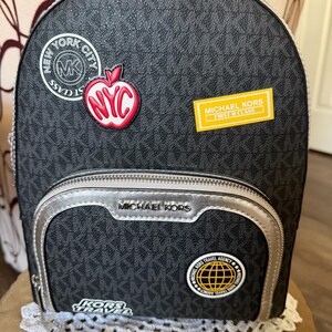 black leather backpack michael kors Michael Merritt Small Pebbled Cargo Updated this season in python Michael Kors Leather Backpack -
