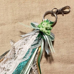 A cute green dragon tassel.