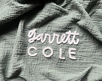 Personalized Hand-Embroidered Muslin Baby Swaddle – Chunky Knit Name Blanket, Nursery Decor