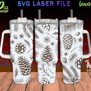 May include: A white 40 ounce tumbler with a handle and a lid. The tumbler has a seamless design featuring a repeating pattern of pine cones, branches, and stars. The text "SVG LASER FILE" and "Seamless" is visible at the top of the image.