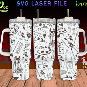 May include: White 40 oz tumbler with a full wrap design featuring a seamless pattern of art supplies in brown. The design includes paint tubes, brushes, palettes, and easels. The tumbler has a handle and a straw. The text "SVG LASER FILE" and "Seamless" are visible.