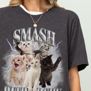 May include: A dark gray t-shirt with a graphic of kittens and the text "SMASH PATRIARCHY" printed on the front.