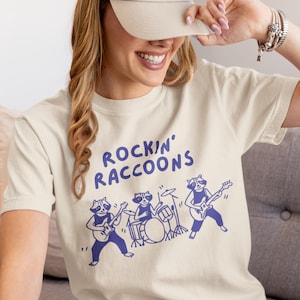 Rocking Raccoons, witziges Rock Band Shirt mit Waschbär Illustration, Musikfan Musikliebhaber T-Shirt, Unisex Damen Herren Oversize