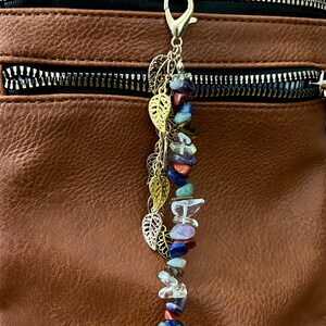 May include: A set of three ceramic vases in varying heights and shapes. The vases are glazed in a matte white finish, offering a minimalist aesthetic. The tallest vase is approximately 10 inches high.