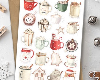 Puede incluir: Una hoja de pegatinas con ilustraciones en acuarela de tazas de chocolate caliente con diferentes coberturas y diseños. Las pegatinas incluyen tazas con crema batida, malvaviscos y decoraciones navideñas. El texto "Hot Chocolate" es visible en la parte superior.