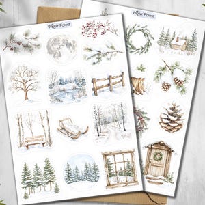 May include: Two sheets of winter-themed stickers with watercolor illustrations. The stickers feature snowy scenes, including a full moon, pine cones, a wooden fence, a sled, and a cabin. The text "Winter Forest" is at the top.