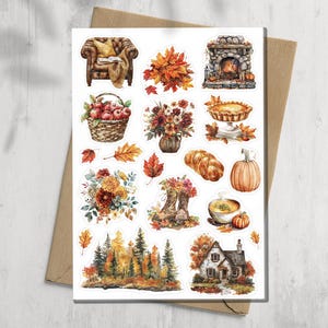 May include: A sticker sheet featuring watercolor illustrations of autumn themes including a leather armchair, a basket of red apples, a stone fireplace, a pumpkin pie, a braided loaf, a pumpkin, a bowl of soup, a cottage, and various fall foliage.