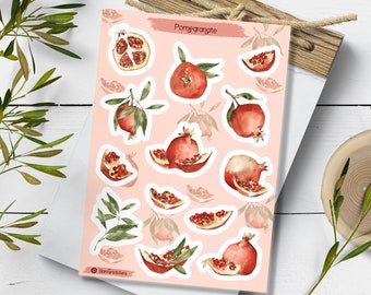 Könnte beinhalten: Eine Bogen mit Aufklebern mit Aquarell-Illustrationen von Granatäpfeln. Die Aufkleber befinden sich auf einem rosa Hintergrund und haben einen weißen Rand. Der Text "Pomegranate" befindet sich oben auf dem Bogen. Der Text "BindGrafixStickers" befindet sich unten auf dem Bogen.