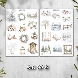 May include: Two sheets of winter-themed stickers with watercolor illustrations. The stickers feature snowy trees, wreaths, cabins, and a full moon. The text "Winter Forest" is at the top of each sheet, and "Set Of 2" is at the bottom.