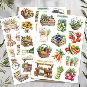 May include: A collection of sticker sheets featuring watercolor illustrations of farmers market items, including wooden crates of produce, sunflowers, a jar of pickles, a market stall, fresh vegetables, herbs in pots, and a tote bag with the text Farmers Market.