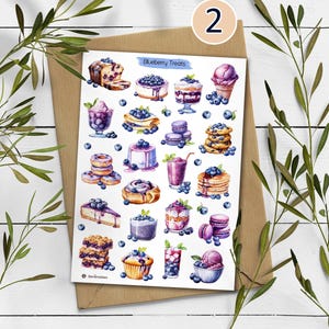 May include: A sticker sheet titled Blueberry Treats featuring various watercolor illustrations of blueberry-themed desserts including cakes, pancakes, donuts, muffins, macarons, parfaits, smoothies, and ice cream, all decorated with fresh blueberries.