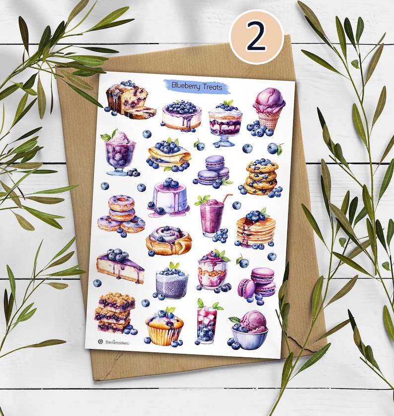 May include: A sticker sheet titled Blueberry Treats featuring various watercolor illustrations of blueberry-themed desserts including cakes, pancakes, donuts, muffins, macarons, parfaits, smoothies, and ice cream, all decorated with fresh blueberries.
