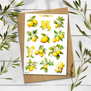 May include: A sheet of stickers featuring watercolor illustrations of lemons, lemon slices, lemon trees, and lemon-themed treats like lemonade and ice pops. The stickers are on a white background and have the word "Lemon" printed at the top.