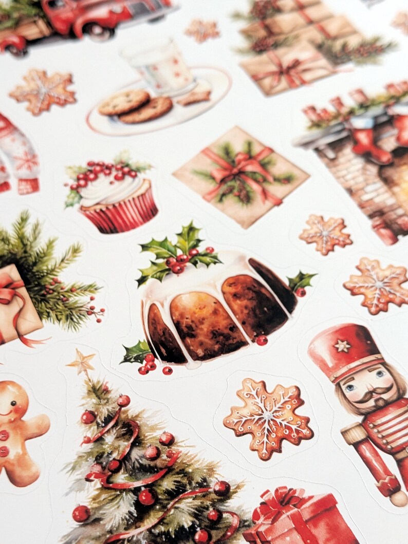 May include: A sticker sheet featuring various Christmas-themed illustrations including a red truck, cookies with milk, wrapped gifts, a fireplace, a cupcake, a Christmas pudding with holly, a gingerbread person, a tree, and a nutcracker.