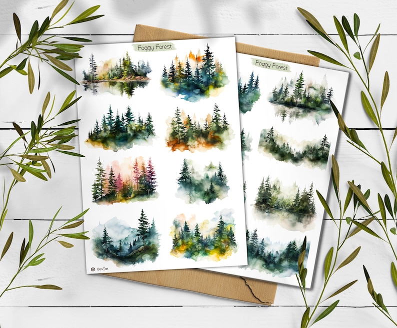 May include: A sheet of stickers featuring watercolor illustrations of foggy forests. The stickers are arranged in a grid pattern and have the text "Foggy Forest" at the top.