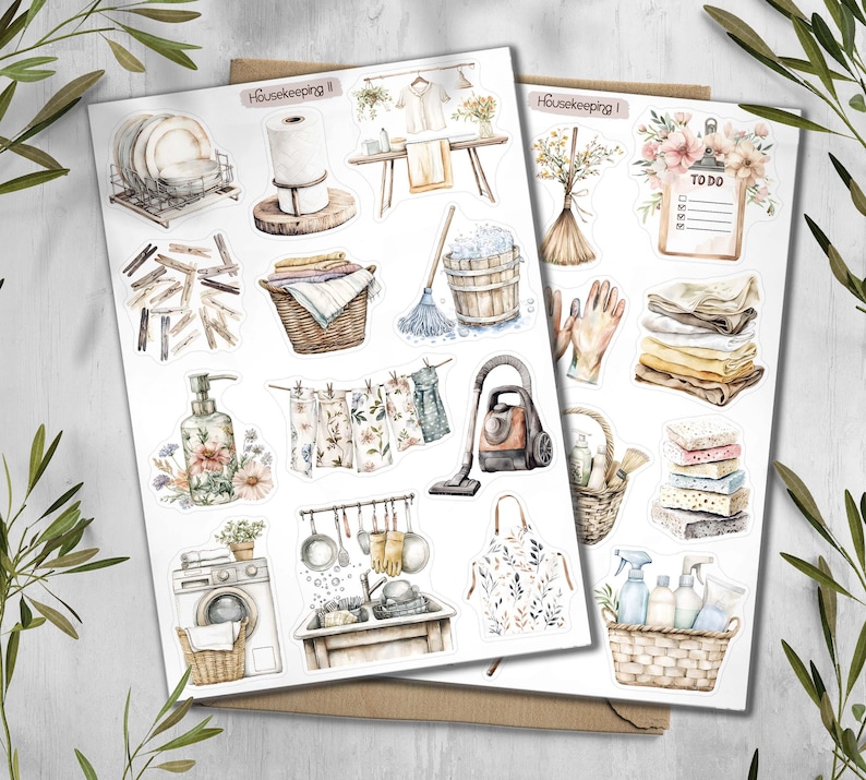 May include: Two sheets of watercolor stickers with a housekeeping theme. The stickers depict various cleaning supplies, laundry items, and kitchenware. The text "Housekeeping" is visible on the top of each sheet. The color palette is soft, with muted tones of beige, green, and brown.
