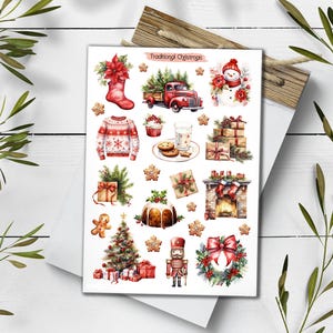 May include: A sticker sheet titled Traditional Christmas featuring watercolor illustrations of a red truck, snowman, poinsettia, sweater, cookies, milk, gifts, fireplace, gingerbread man, Christmas tree, nutcracker, and wreath on a white background.