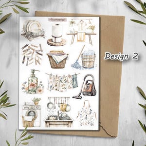May include: A sticker sheet with watercolor illustrations of household items, including dishes, laundry, cleaning supplies, and a washing machine. The text "Housekeeping II" is at the top, and "Design 2" is on the right side.