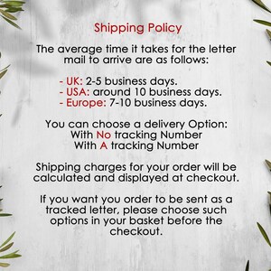 May include: A white informational sign with a light gray wood grain texture and green olive branch illustrations on the left and right sides. The text reads Shipping Policy, detailing delivery times for the UK, USA, and Europe, and tracking options.