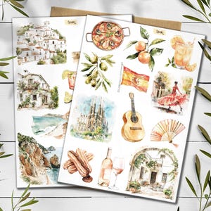 May include: Two sheets of watercolour illustrations depicting Spanish themes. Images include paella, oranges, a Spanish flag, a flamenco dancer, a guitar, and architectural landmarks. The word "Spain" is written on the top of the sheets.