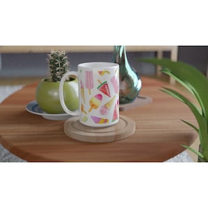 May include: White ceramic mug with a colorful watercolor pattern of ice cream cones, popsicles, and watermelon slices.