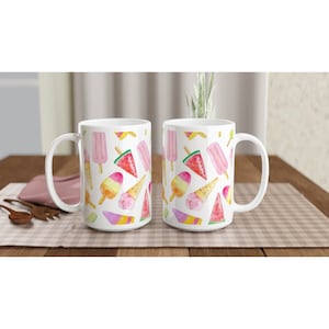 May include: Two white ceramic mugs with a summery ice cream and watermelon pattern. The mugs have a white background with colorful illustrations of ice cream cones, popsicles, and watermelon slices.