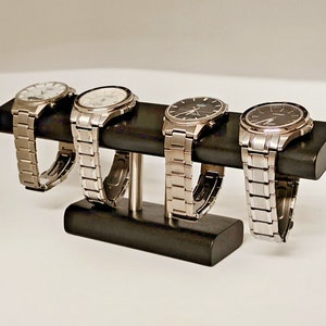 Svart klockställ, klockhållare, klockdisplay, klockask, smyckesställ, presentidé, klockförvaring, present, ebenholtsträ, handgjort