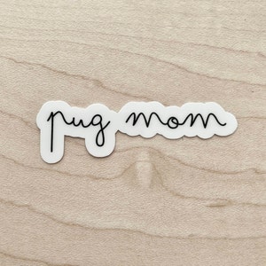 May include: White sticker with black cursive text that reads "pug mom".