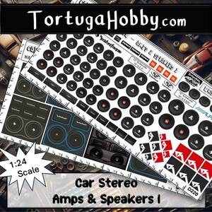 May include: A 1:24 scale decal sheet from TortugaHobby.com featuring various car audio equipment graphics, including Rockford Fosgate, JBL, and Alpine logos, subwoofers, and amplifiers, with a printed ruler along the edge for size reference.
