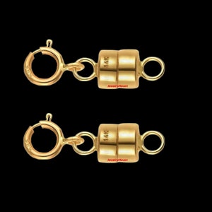 May include: Two gold magnetic clasps for necklaces or bracelets. Each clasp is marked "14K" and has a spring ring closure.