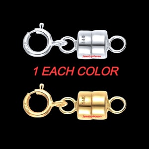 May include: Two 14K gold magnetic clasps, one in silver and one in gold. Each clasp has a round ring on one end and a cylindrical magnetic piece on the other end. The text "14K" is visible on the magnetic piece.