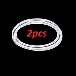 May include: Two clear, oval-shaped rings against a black background. The text "2pcs" is displayed in red within the center of the rings. The rings appear to be made of a transparent material.
