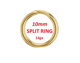 May include: A gold-colored split ring with a 10mm diameter and 14 gauge thickness. The text "10mm SPLIT RING 14ga" is displayed in red. The ring is circular and sits against a white background.