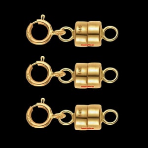 May include: Three gold magnetic clasps for necklaces or bracelets. Each clasp is marked "14K" and "JewelryMaven".
