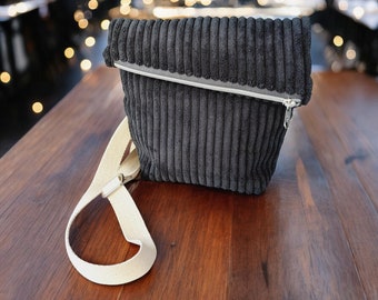 Foldover crossbody bag made of wide corduroy in black, shoulder bag