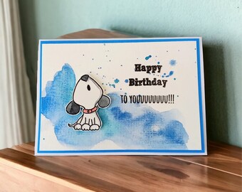 Carte d'anniversaire faite à la main avec un chien, bleue