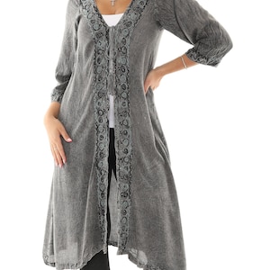 May include: A gray long-sleeved cardigan with a V-neckline and intricate embroidery along the front. The cardigan has a relaxed fit and a flowing silhouette.
