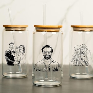 May include: Three glass tumblers with bamboo lids and straws. Each tumbler features a black and white photo of a family.