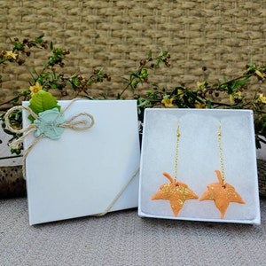 Dangling orange fall leaf with gold leaf and gold chain