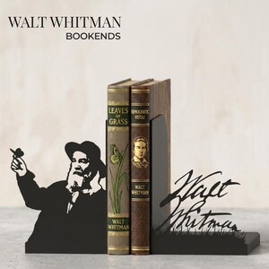 May include: Black metal bookends featuring a silhouette of Walt Whitman and his signature. The bookends hold two vintage-style books titled "Leaves of Grass" and "Democratic Vistas". The text "WALT WHITMAN BOOKENDS" is at the top.