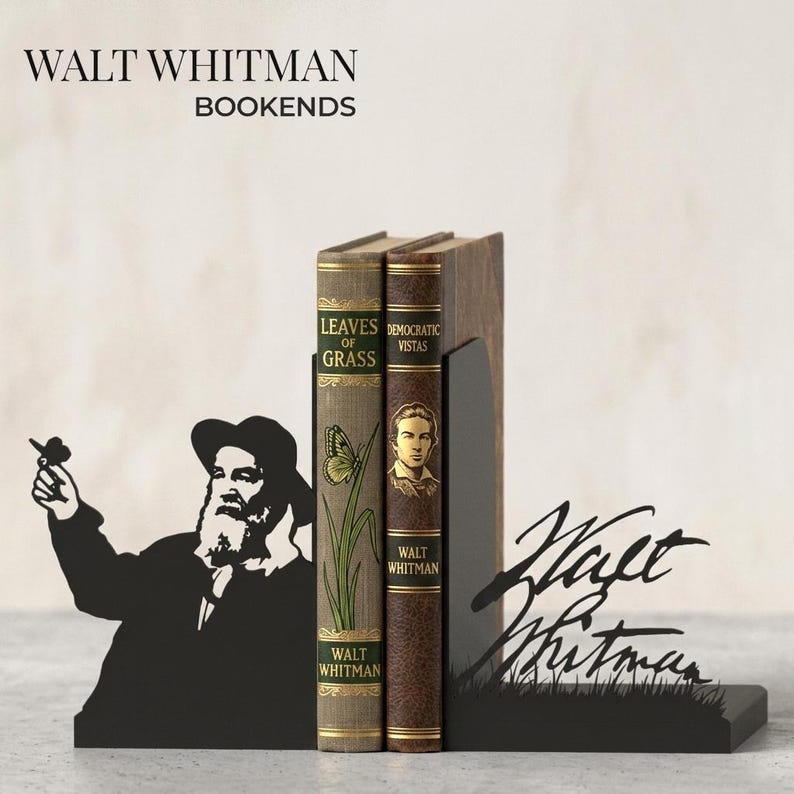May include: Black metal bookends featuring a silhouette of Walt Whitman and his signature. The bookends hold two vintage-style books titled "Leaves of Grass" and "Democratic Vistas". The text "WALT WHITMAN BOOKENDS" is at the top.