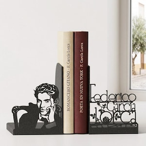 May include: Black metal bookends featuring a silhouette of Federico Garc&iacute;a Lorca and his name. The left bookend depicts Lorca in profile. Two books are held between the bookends, with titles by F. Garc&iacute;a Lorca.