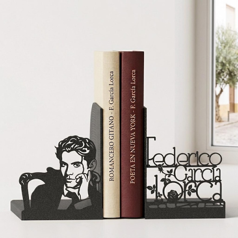 May include: Black metal bookends featuring a silhouette of Federico Garc&iacute;a Lorca and his name. The left bookend depicts Lorca in profile. Two books are held between the bookends, with titles by F. Garc&iacute;a Lorca.