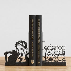 May include: Black metal bookends featuring a silhouette of Federico Garc&iacute;a Lorca and his name. Two black books stand between the bookends, with titles and author's name visible. The bookends add a decorative touch to any bookshelf.